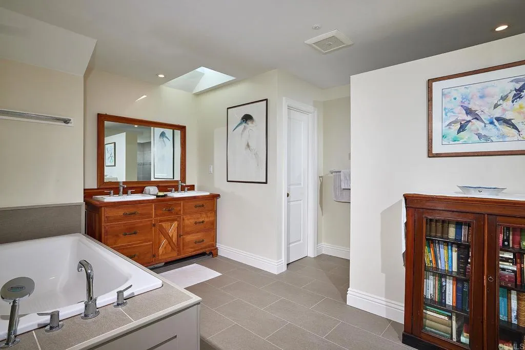 4613 Sun Valley Road Del Mar, CA 92014 - Photo 21 of 55 a living room with furniture and a flat screen tv