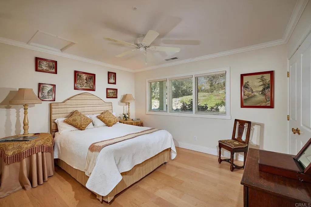 4613 Sun Valley Road Del Mar, CA 92014 - Photo 22 of 55 a bedroom with a bed and a window