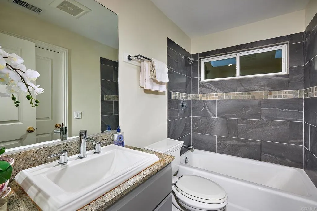 4613 Sun Valley Road Del Mar, CA 92014 - Photo 26 of 55 a bathroom with a sink toilet and shower