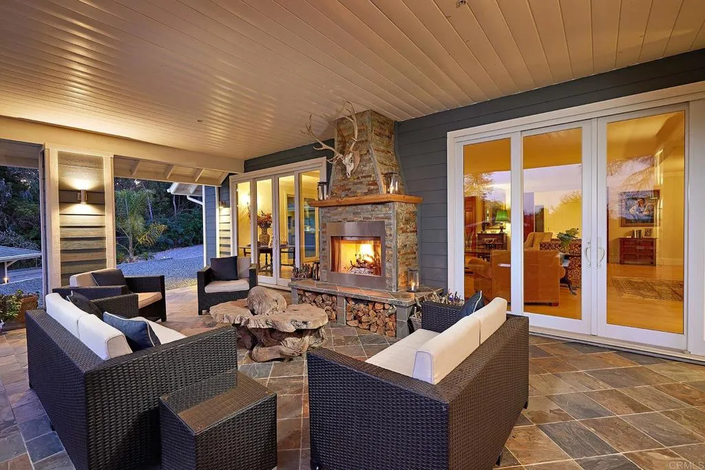 4613 Sun Valley Road Del Mar, CA 92014 - Photo 28 of 55 a living room with fireplace furniture and a large window