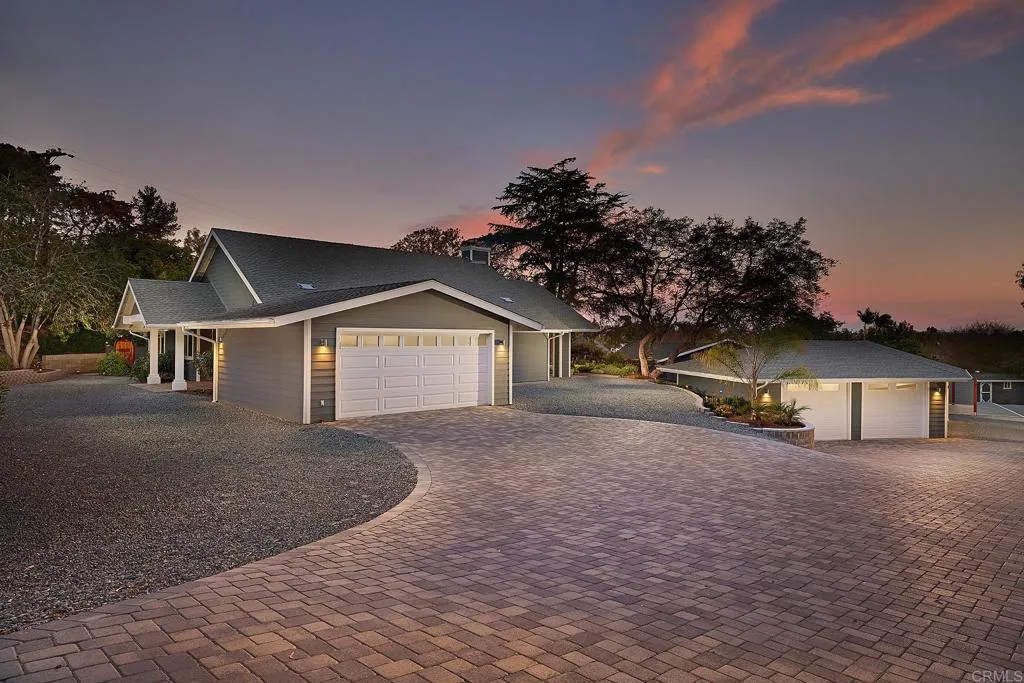 4613 Sun Valley Road Del Mar, CA 92014 - Photo 31 of 55 a view of a house with a yard and garage