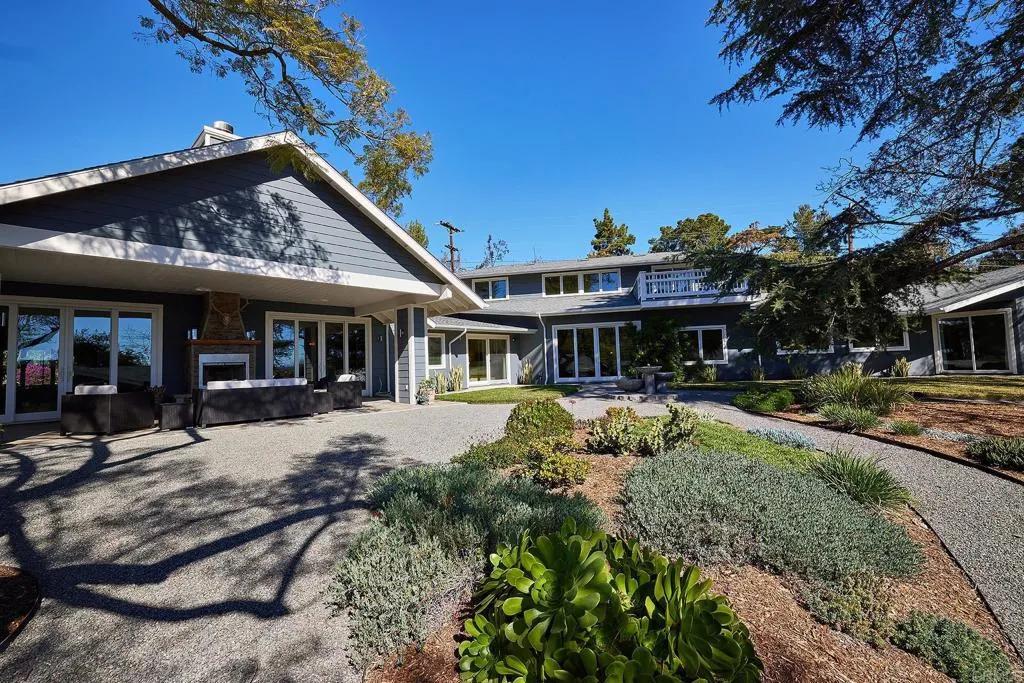 4613 Sun Valley Road Del Mar, CA 92014 - Photo 35 of 55 a front view of a house with a yard table and chairs