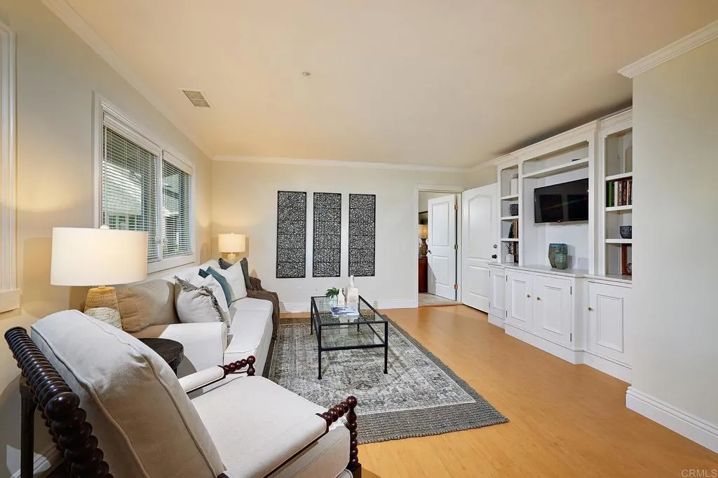 4613 Sun Valley Road Del Mar, CA 92014 - Photo 37 of 55 a living room with furniture and a flat screen tv