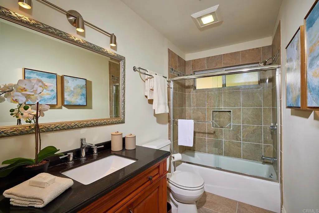 4613 Sun Valley Road Del Mar, CA 92014 - Photo 39 of 55 a bathroom with a sink a toilet and shower