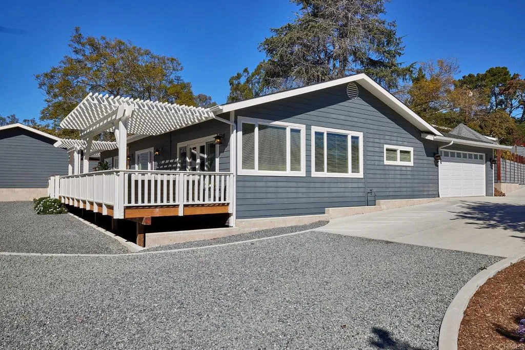 4613 Sun Valley Road Del Mar, CA 92014 - Photo 42 of 55 a backyard of a house with a deck and wooden floor