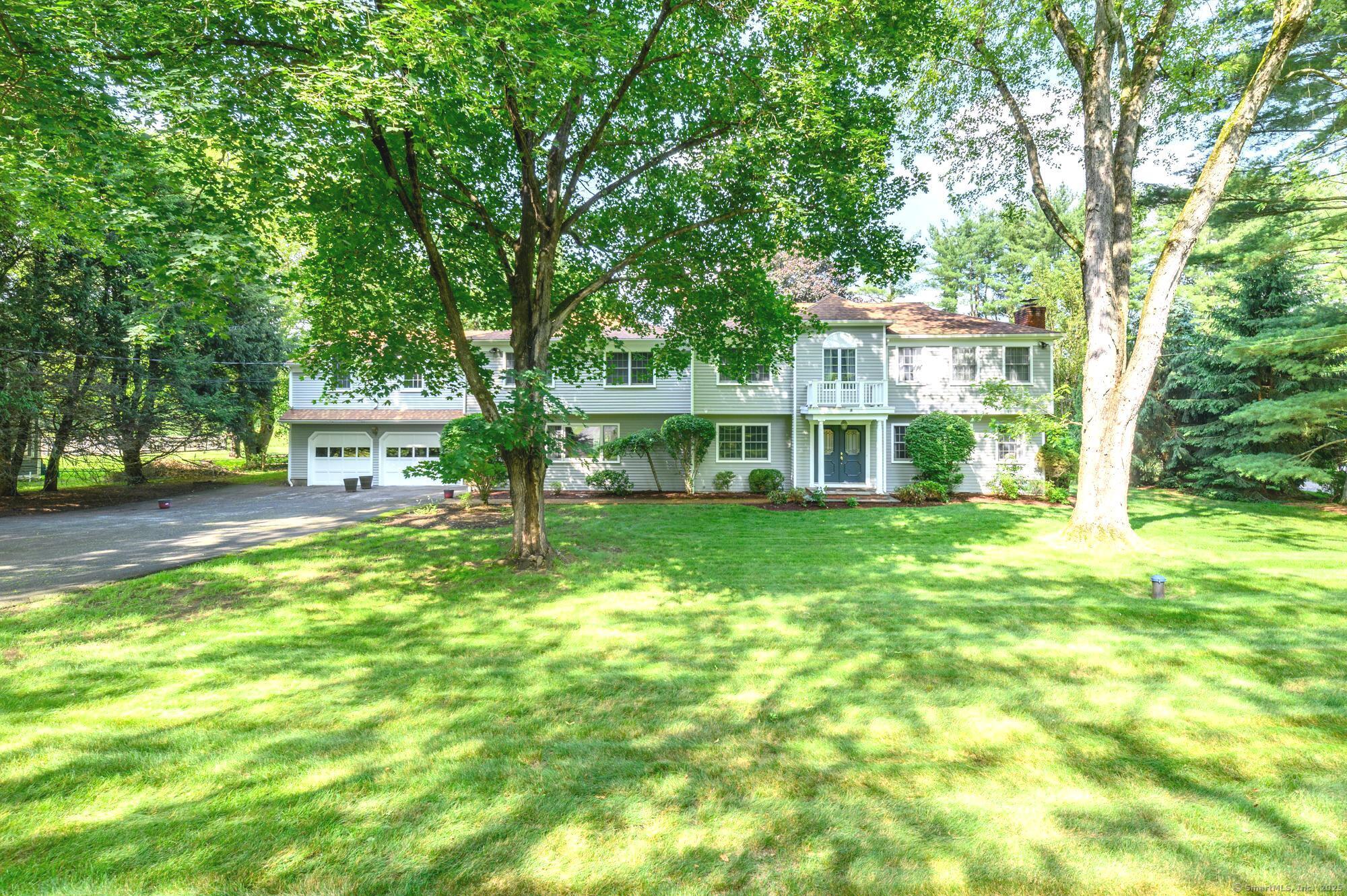 a view of house with yard