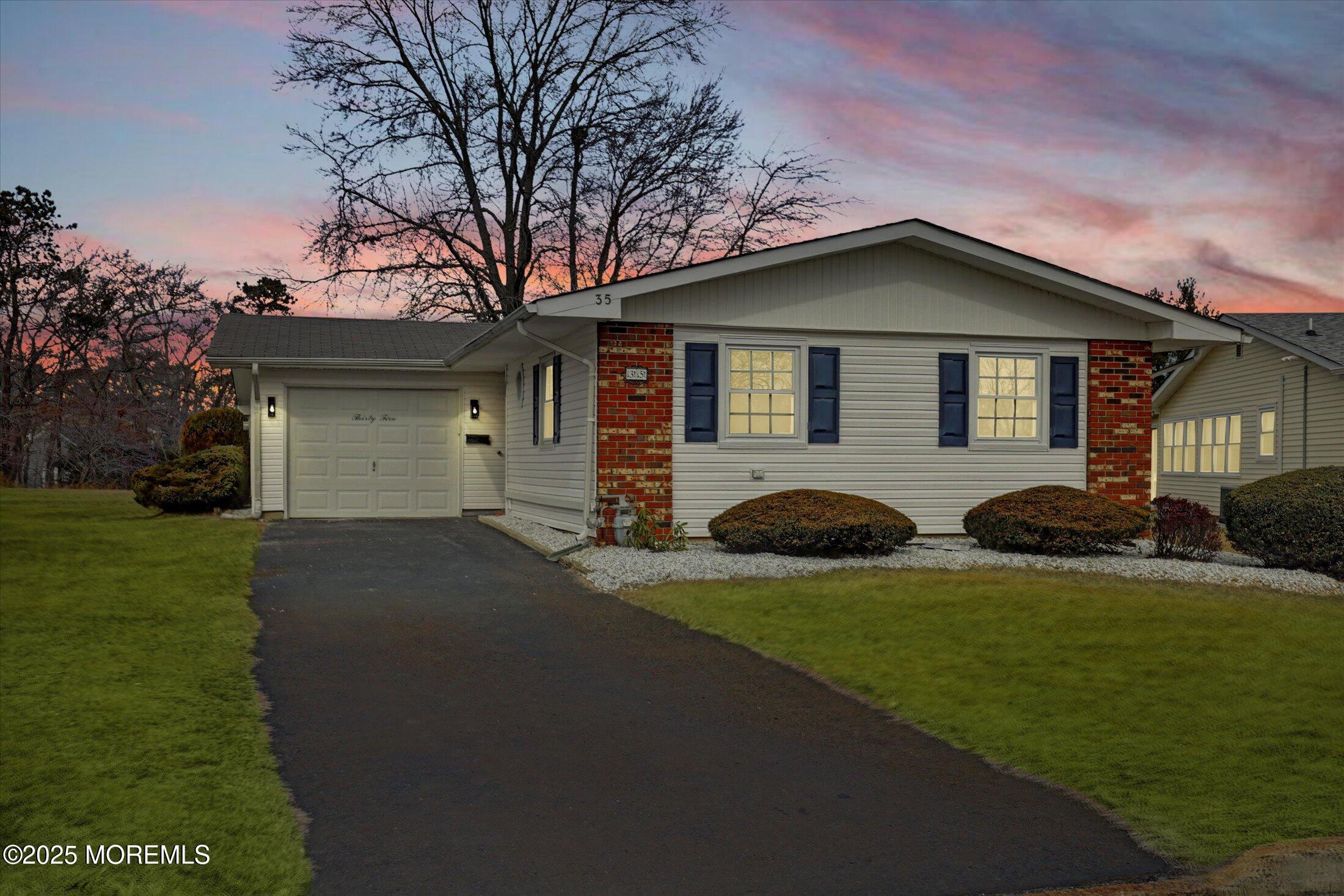 35 Patmore Road Brick, NJ 08724 - Photo 1 of 65 a front view of house with yard and green space