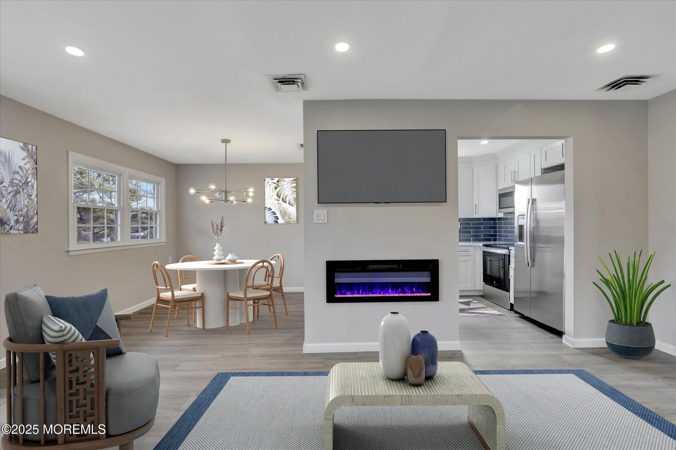 35 Patmore Road Brick, NJ 08724 - Photo 12 of 65 a living room with furniture flat screen tv and a fireplace