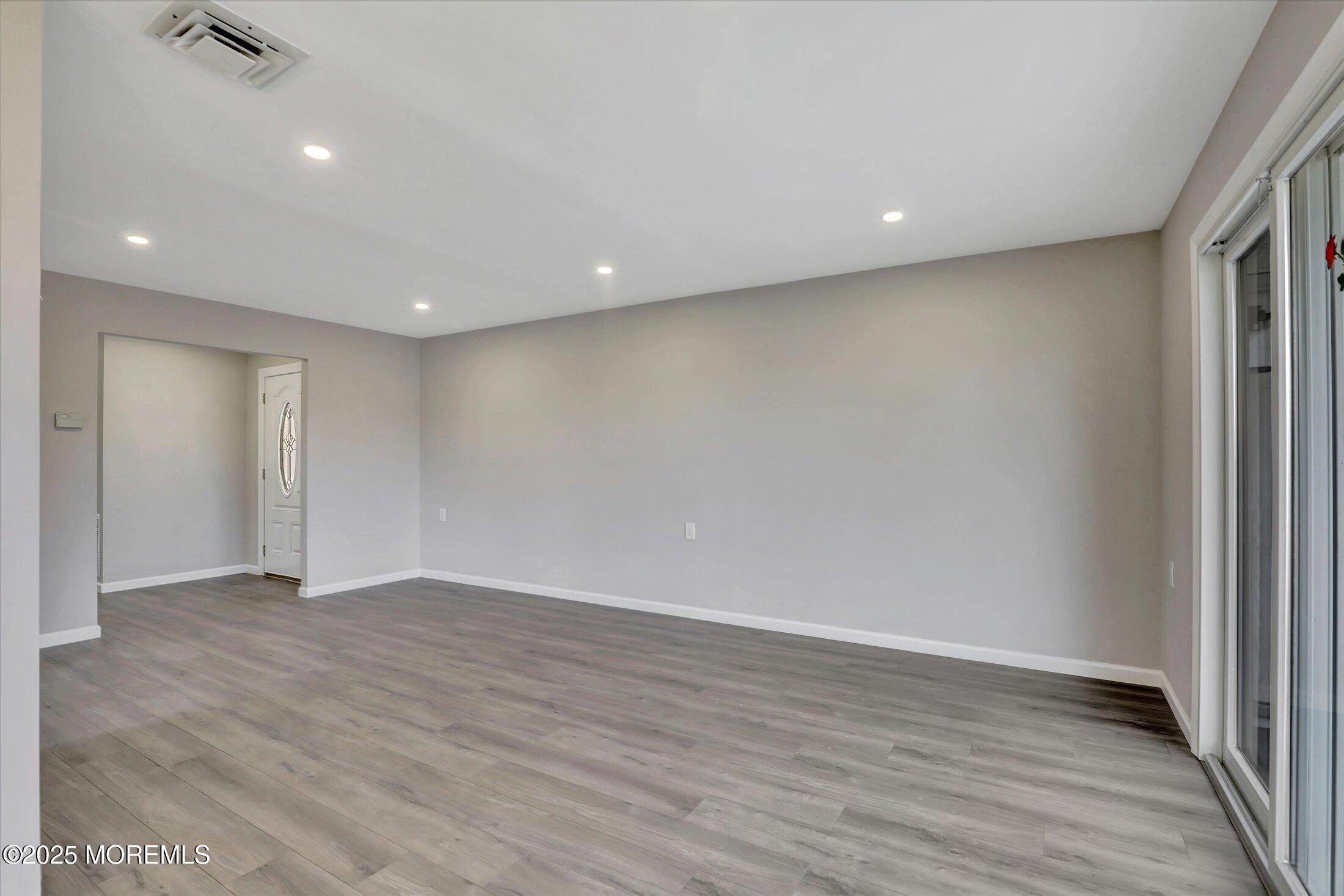 35 Patmore Road Brick, NJ 08724 - Photo 14 of 65 a view of an empty room with wooden floor