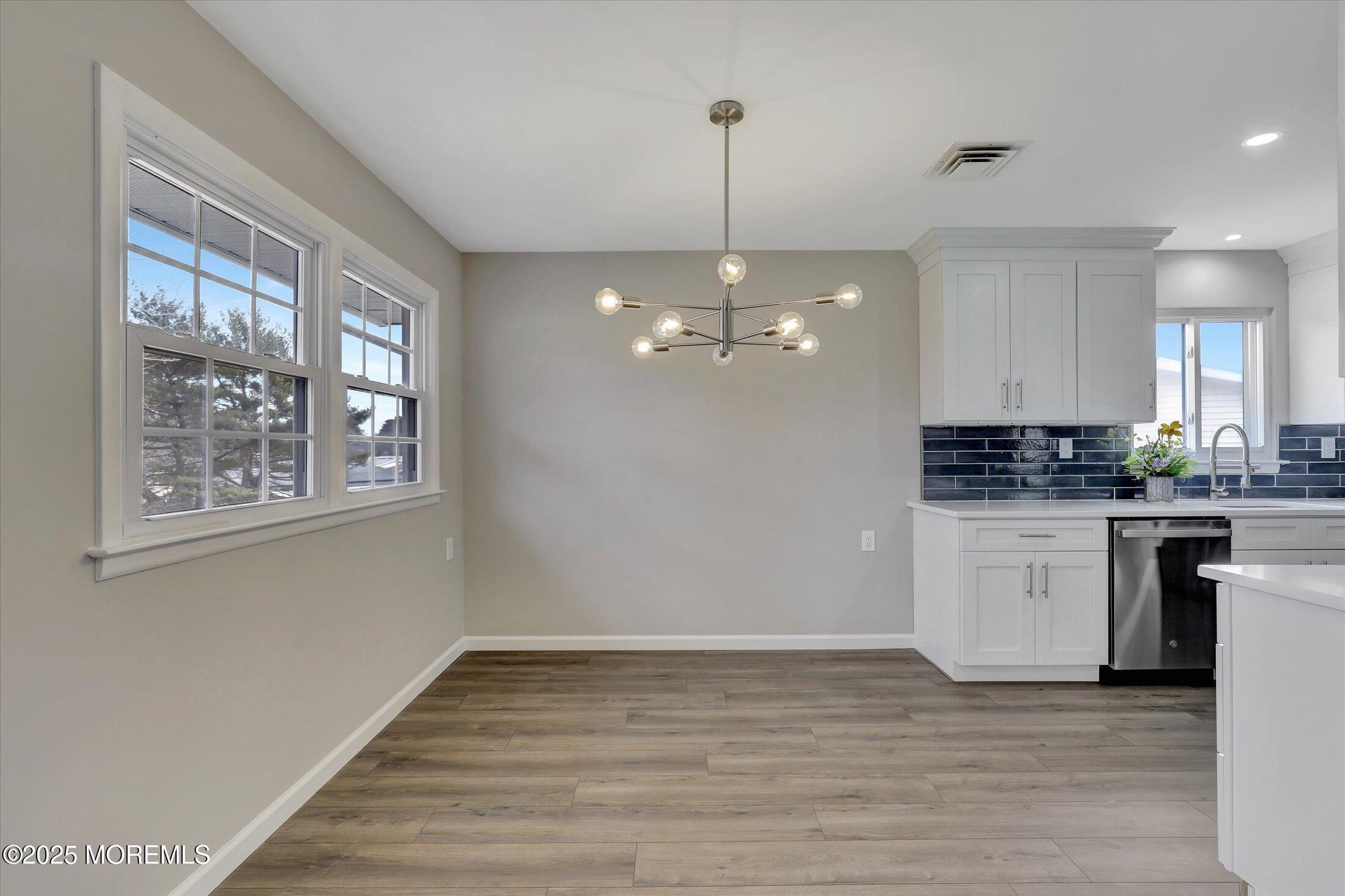 35 Patmore Road Brick, NJ 08724 - Photo 15 of 65 a view of an empty room with kitchen and window