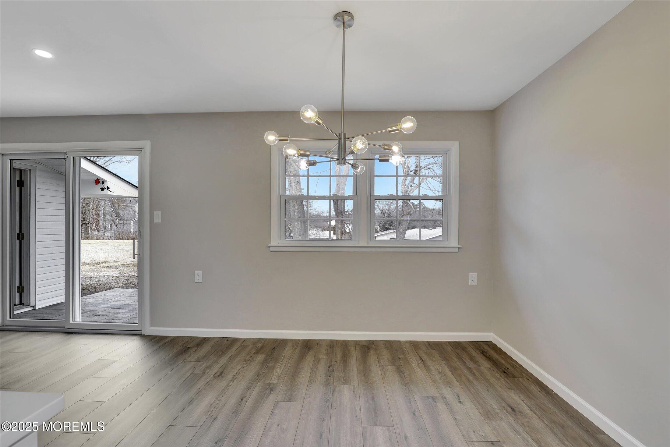 35 Patmore Road Brick, NJ 08724 - Photo 17 of 65 a view of an empty room with wooden floor and a window