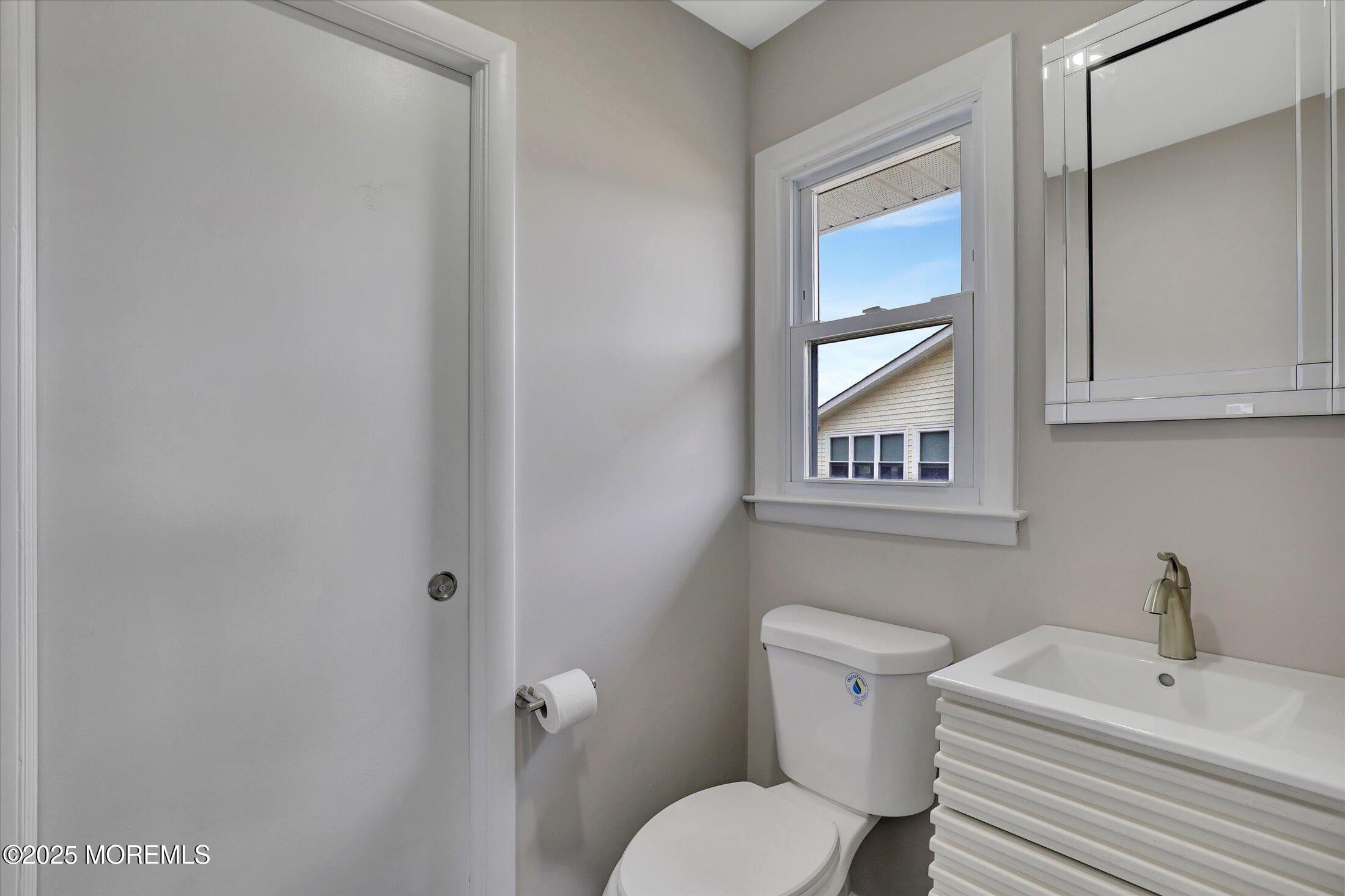 35 Patmore Road Brick, NJ 08724 - Photo 29 of 65 a white toilet sitting next to a bathroom sink