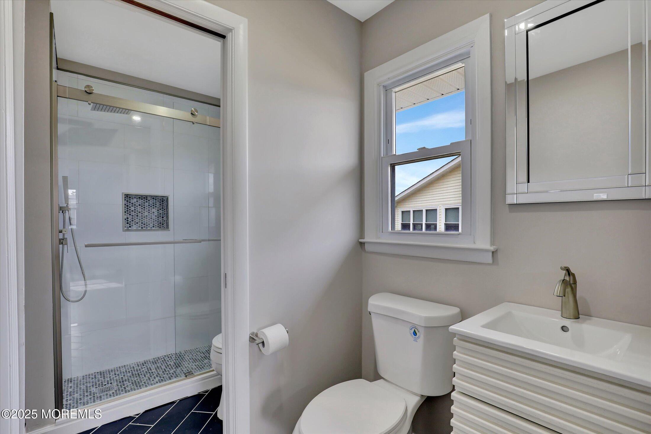 35 Patmore Road Brick, NJ 08724 - Photo 30 of 65 a white toilet sitting next to a bathroom sink