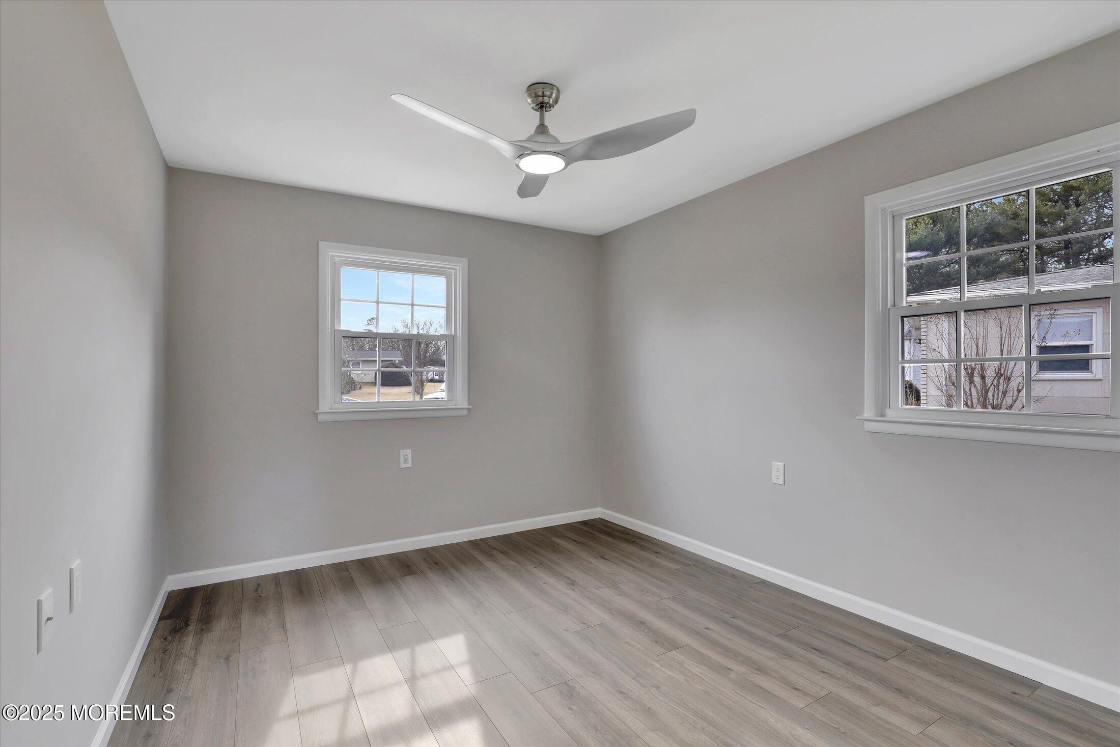 35 Patmore Road Brick, NJ 08724 - Photo 32 of 65 a view of empty room with wooden floor and fan