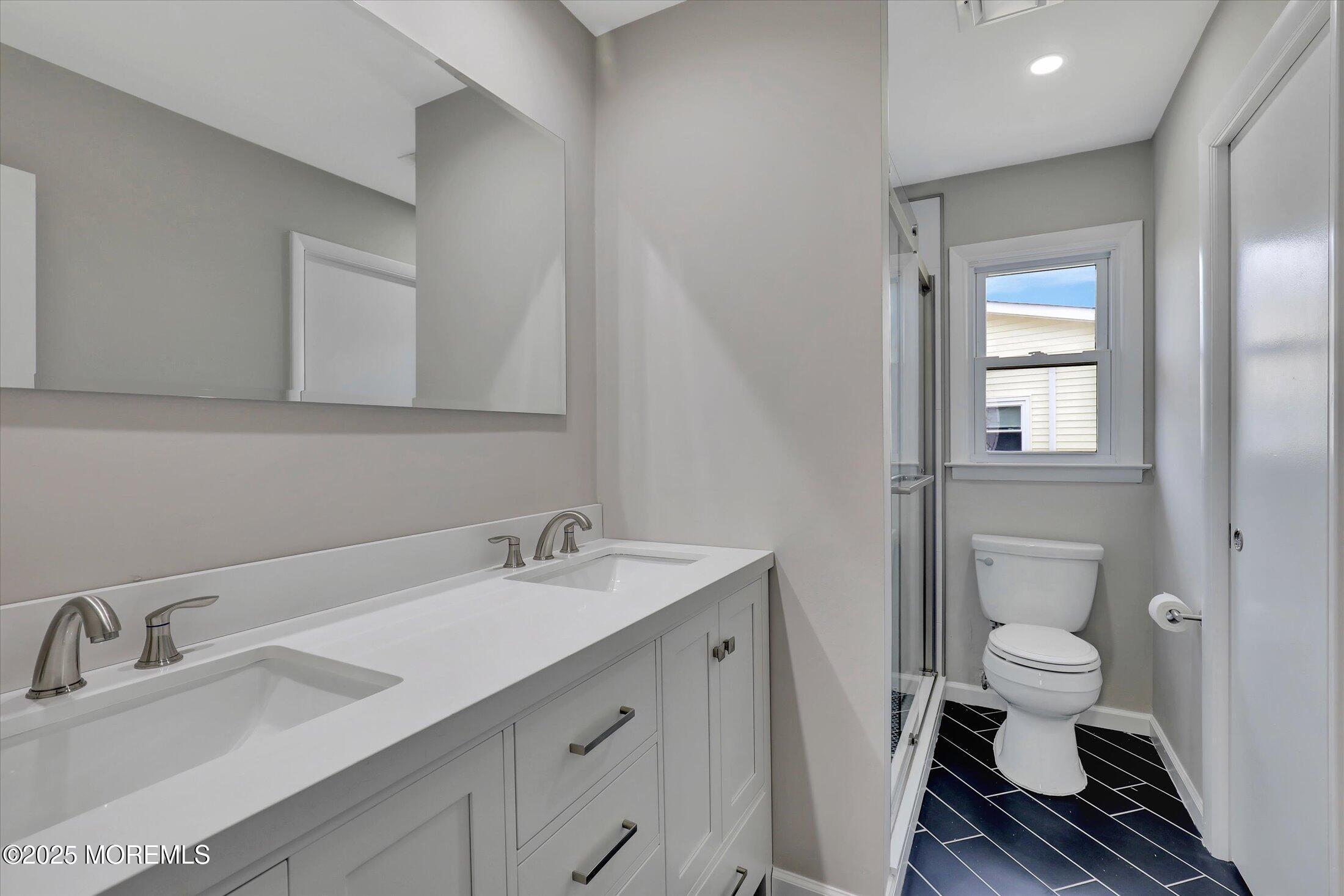 35 Patmore Road Brick, NJ 08724 - Photo 35 of 65 a bathroom with a sink a toilet and a mirror