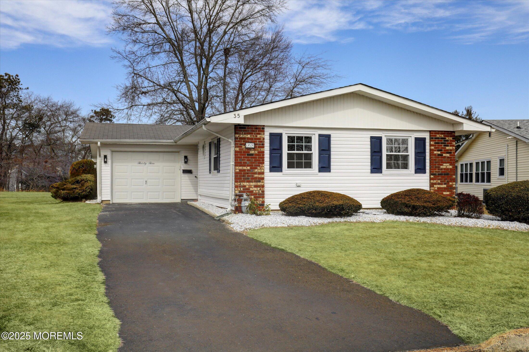 35 Patmore Road Brick, NJ 08724 - Photo 4 of 65 a front view of house with yard and green space
