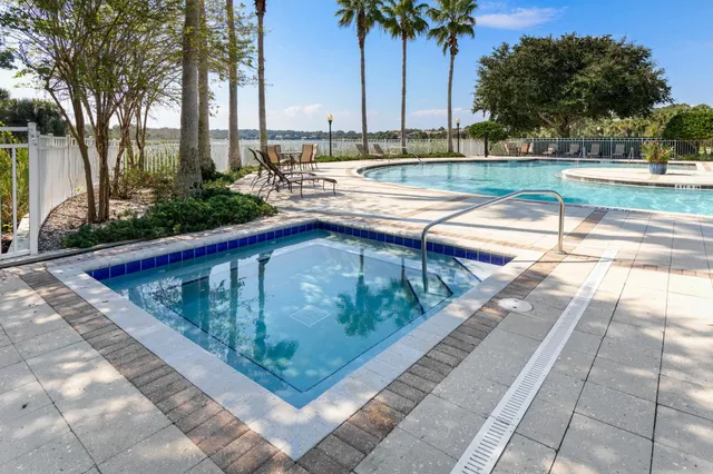 a view of swimming pool with a lounge chair
