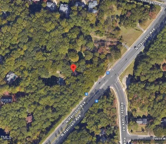 a view of a street with a tree