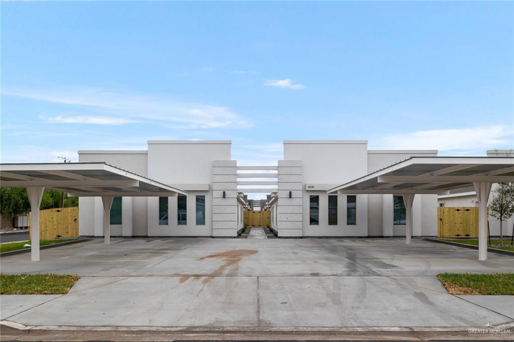 Contemporary house with covered parking and stucco siding