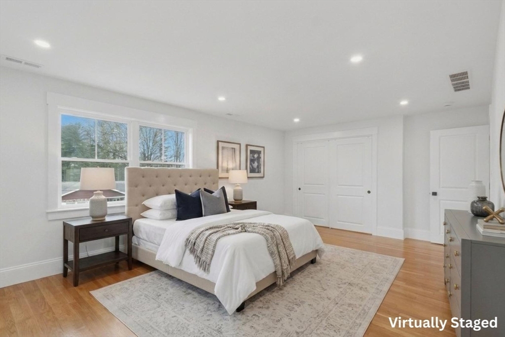 105 Stafford Road Lowell, MA 01852 - Photo 14 of 42 a bedroom with a bed and a table