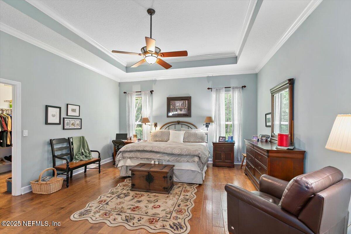 1400 Barrington Circle St. Augustine, FL 32092 - Photo 13 of 45 a bed room with furniture and a chandelier