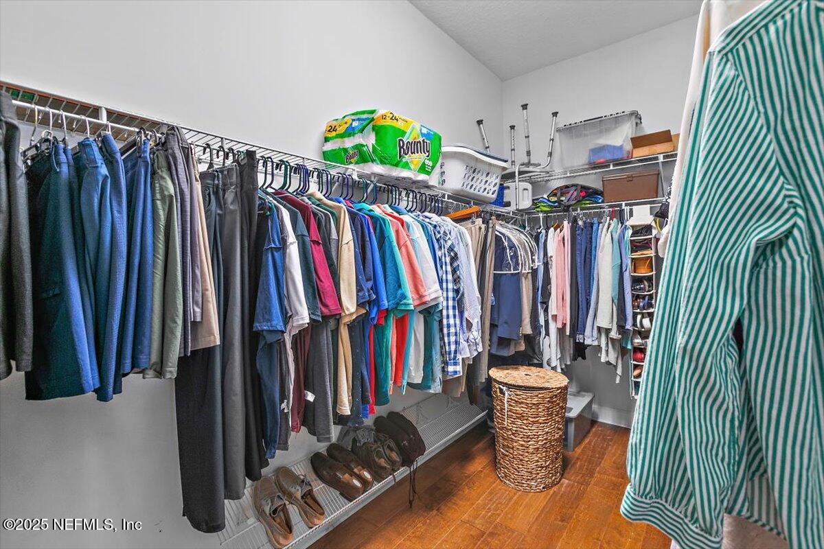 1400 Barrington Circle St. Augustine, FL 32092 - Photo 15 of 45 a view of walk in closet with clothes and shoes