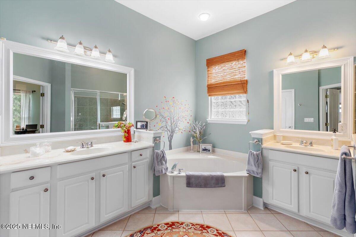 1400 Barrington Circle St. Augustine, FL 32092 - Photo 16 of 45 a spacious bathroom with a double vanity sink mirror and