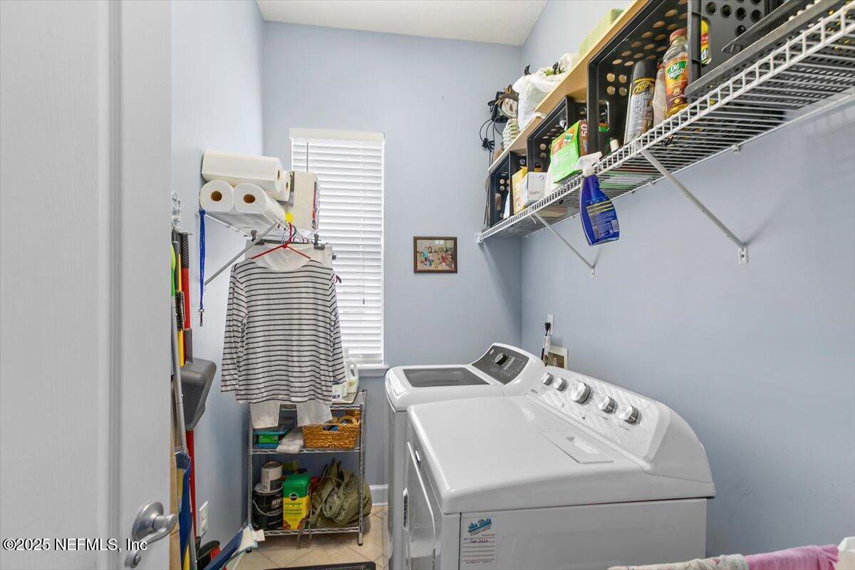 1400 Barrington Circle St. Augustine, FL 32092 - Photo 22 of 45 a utility room with dryer and washer