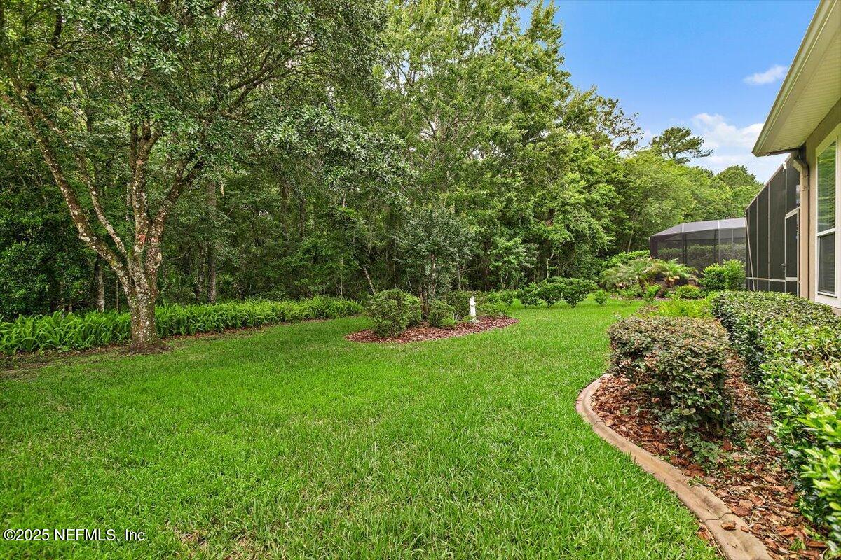 1400 Barrington Circle St. Augustine, FL 32092 - Photo 26 of 45 a view of a garden with plants and large trees