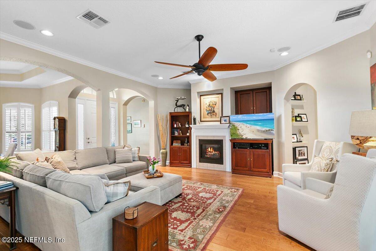 1400 Barrington Circle St. Augustine, FL 32092 - Photo 7 of 45 a living room with furniture a fireplace and a flat screen tv