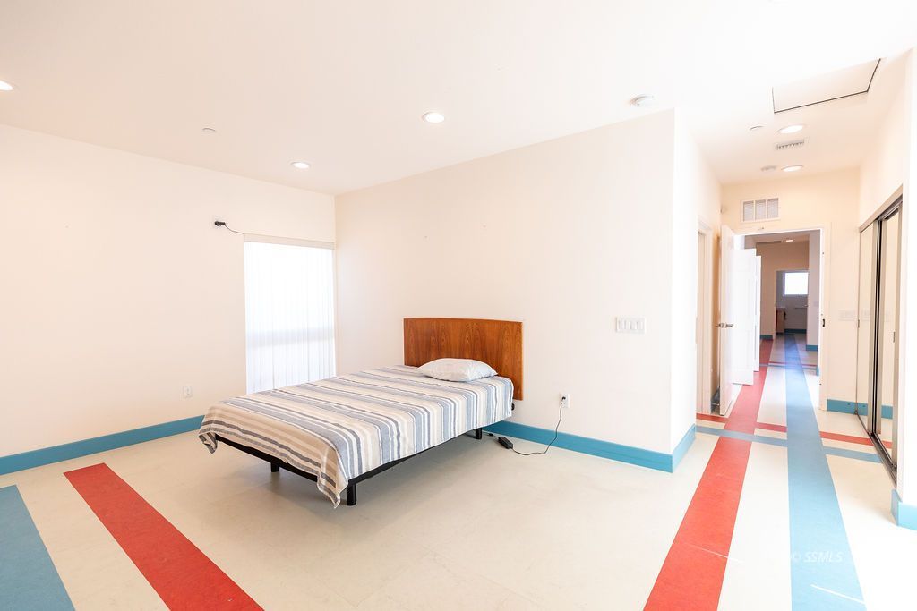 1325 Dunes Street Ridgecrest, CA 93555 - Photo 37 of 50 a spacious bedroom with a bed and a wooden floor