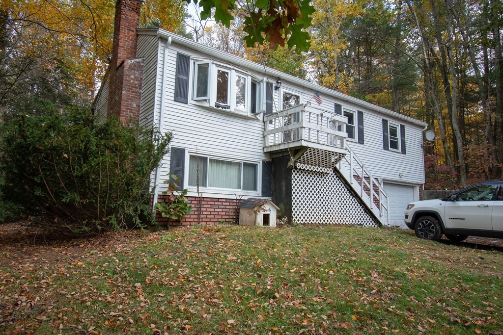 33 Leno Road Holland, MA 01521 - Photo 1 of 32 a front view of house with a garden