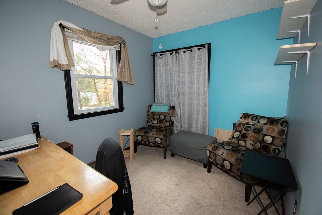 33 Leno Road Holland, MA 01521 - Photo 17 of 32 a bedroom with furniture and a window