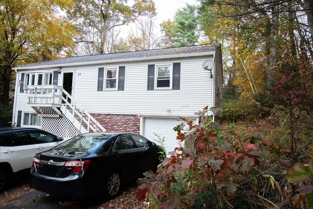33 Leno Road Holland, MA 01521 - Photo 2 of 32 a front view of a house with a garden