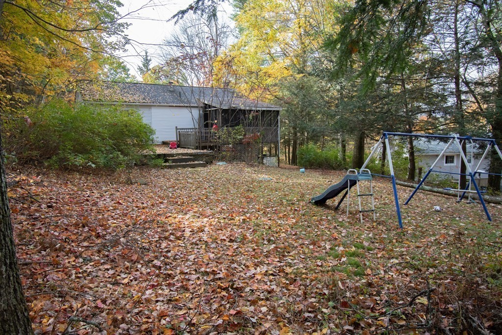 33 Leno Road Holland, MA 01521 - Photo 4 of 32 a view of a backyard with a tree