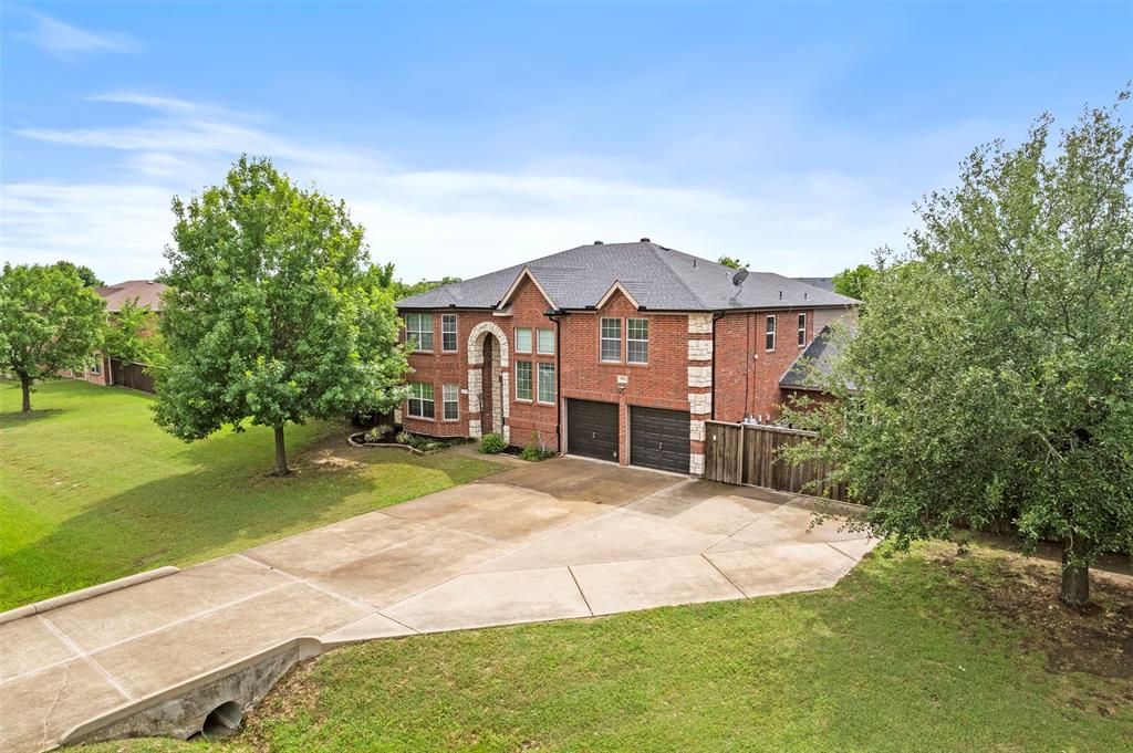 3931 Alpha Way Midlothian, TX 76065 - Photo 3 of 33 a view of a big house with a big yard and large trees