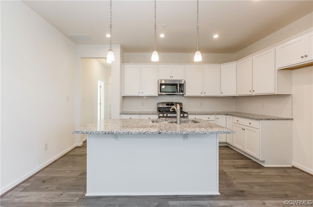 4119 Next Level Trace Midlothian, VA 23112 - Photo 12 of 50 a kitchen with kitchen island a sink stainless steel appliances and cabinets