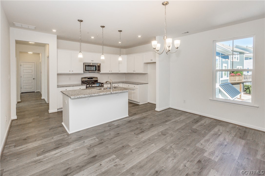 4119 Next Level Trace Midlothian, VA 23112 - Photo 13 of 50 a kitchen with kitchen island a sink stainless steel appliances and window