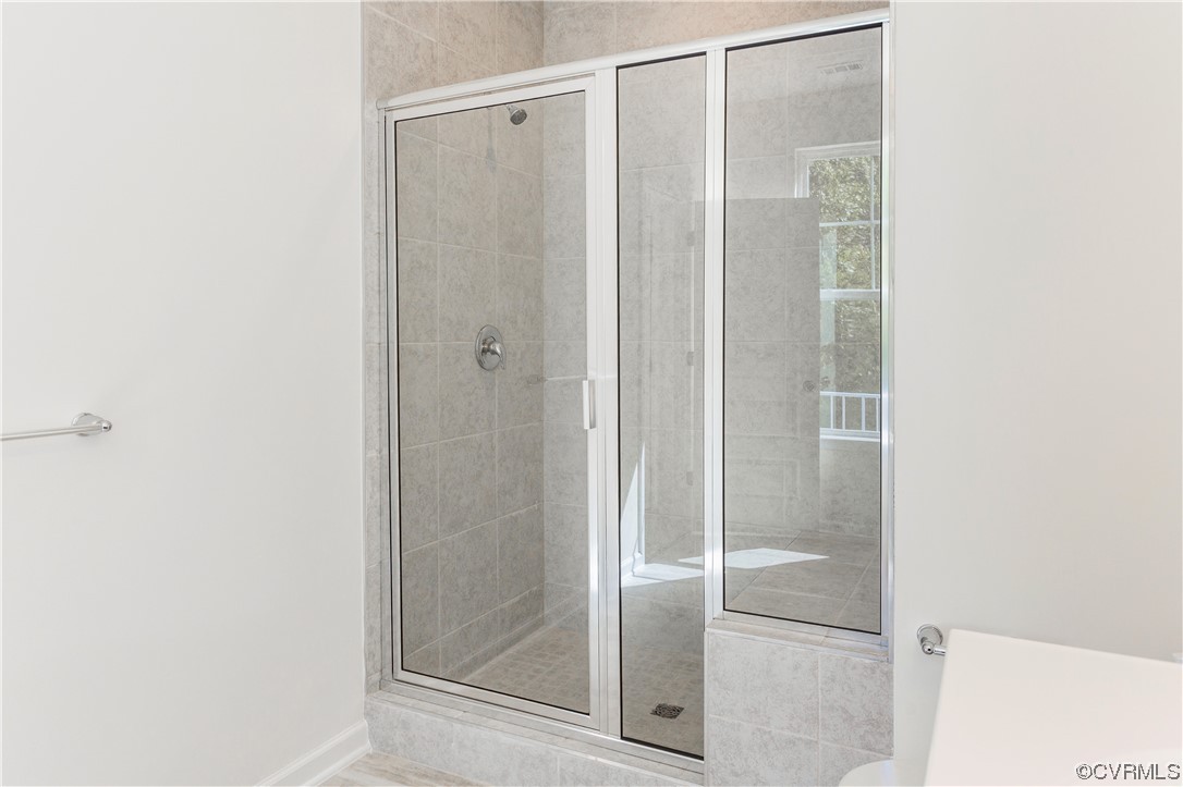 4119 Next Level Trace Midlothian, VA 23112 - Photo 25 of 50 a bathroom with a glass shower door
