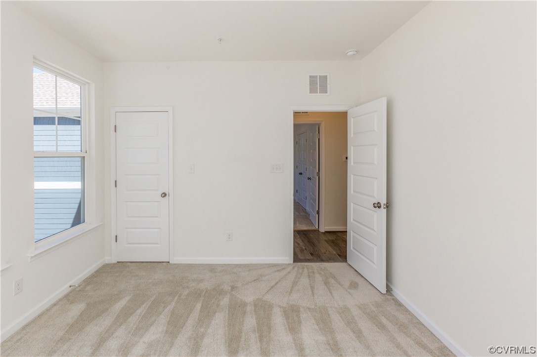 4119 Next Level Trace Midlothian, VA 23112 - Photo 26 of 50 an empty room with windows and closet