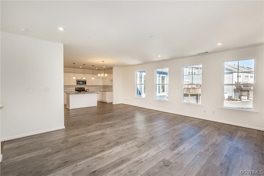 4119 Next Level Trace Midlothian, VA 23112 - Photo 9 of 50 a view of an empty room with wooden floor and a window