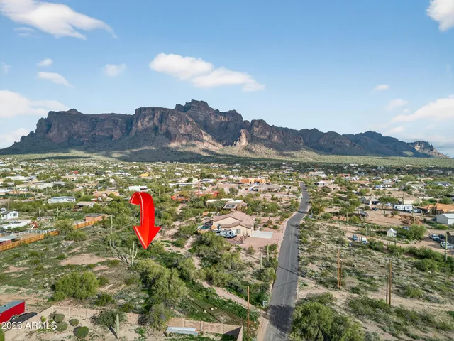 a view of a house with a yard and a large pool