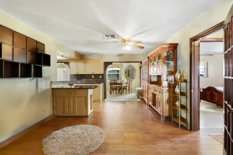 a view of kitchen with cabinets and wooden floor