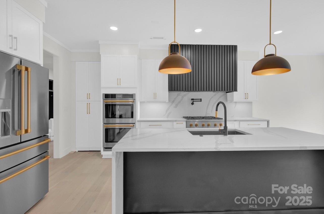 2 Antioch Church Road, Unit 1 Weddington, NC 28104 - Photo 3 of 10 a kitchen with kitchen island a sink stainless steel appliances and cabinets