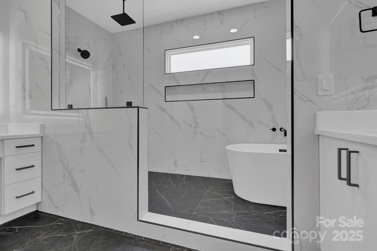 2 Antioch Church Road, Unit 1 Weddington, NC 28104 - Photo 7 of 10 a bathroom with a bathtub and a shower