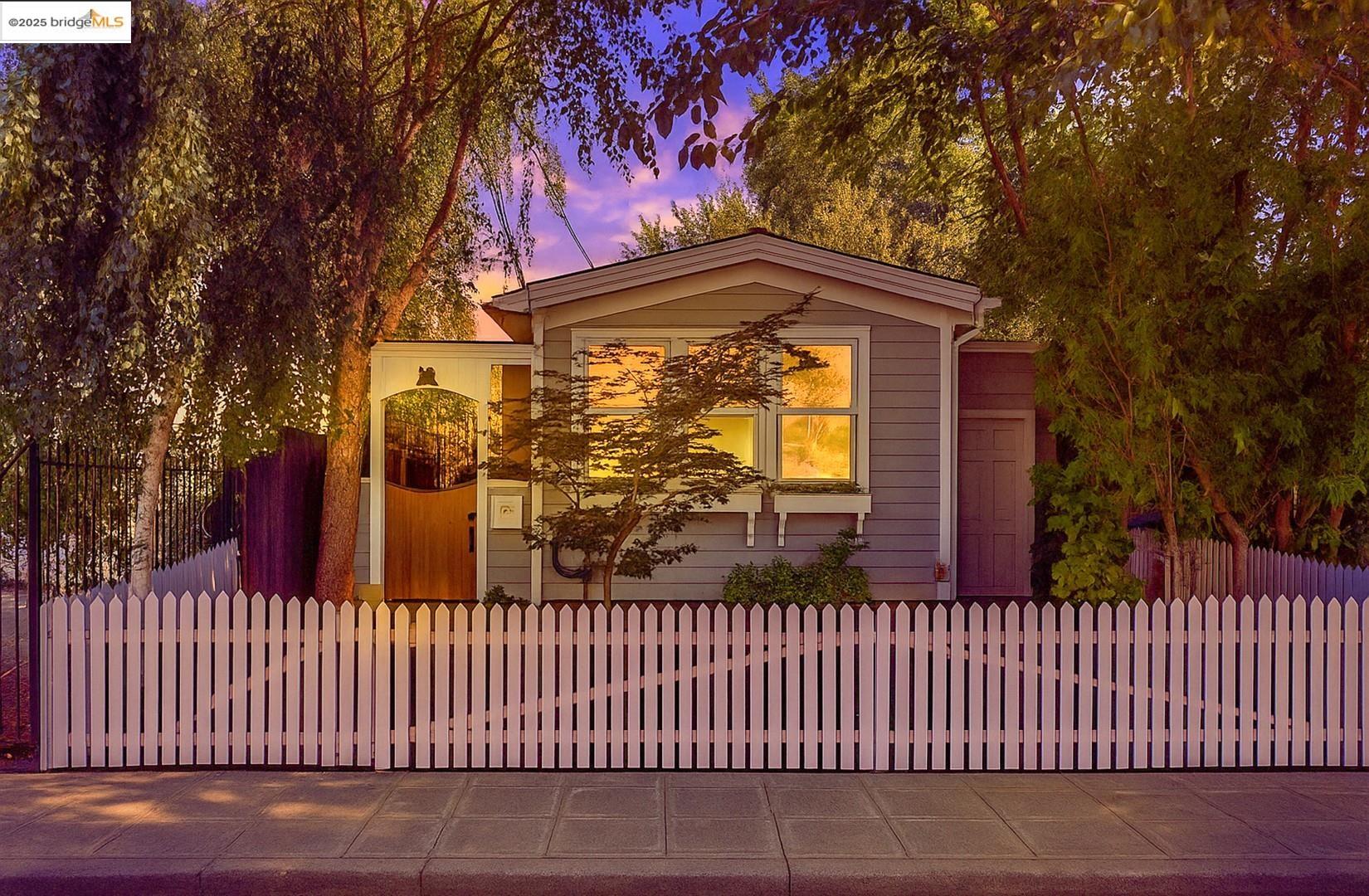 1071 55th Street Oakland, CA 94608 - Photo 1 of 1 a view of a brick house with large windows