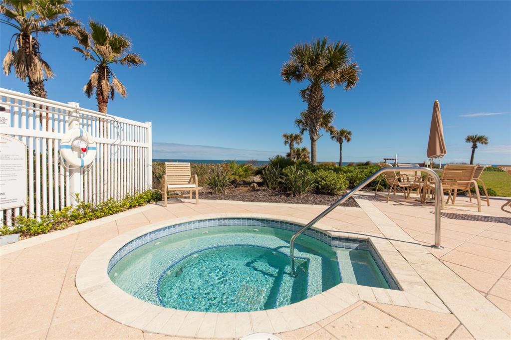 6 Cinnamon Beach Way Palm Coast, FL 32137 - Photo 26 of 58 a swimming pool with a yard and seating space