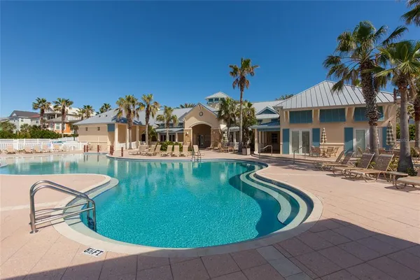 a view of a swimming pool with a lounge chair