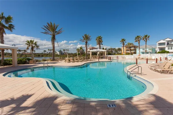 a view of a swimming pool with a patio
