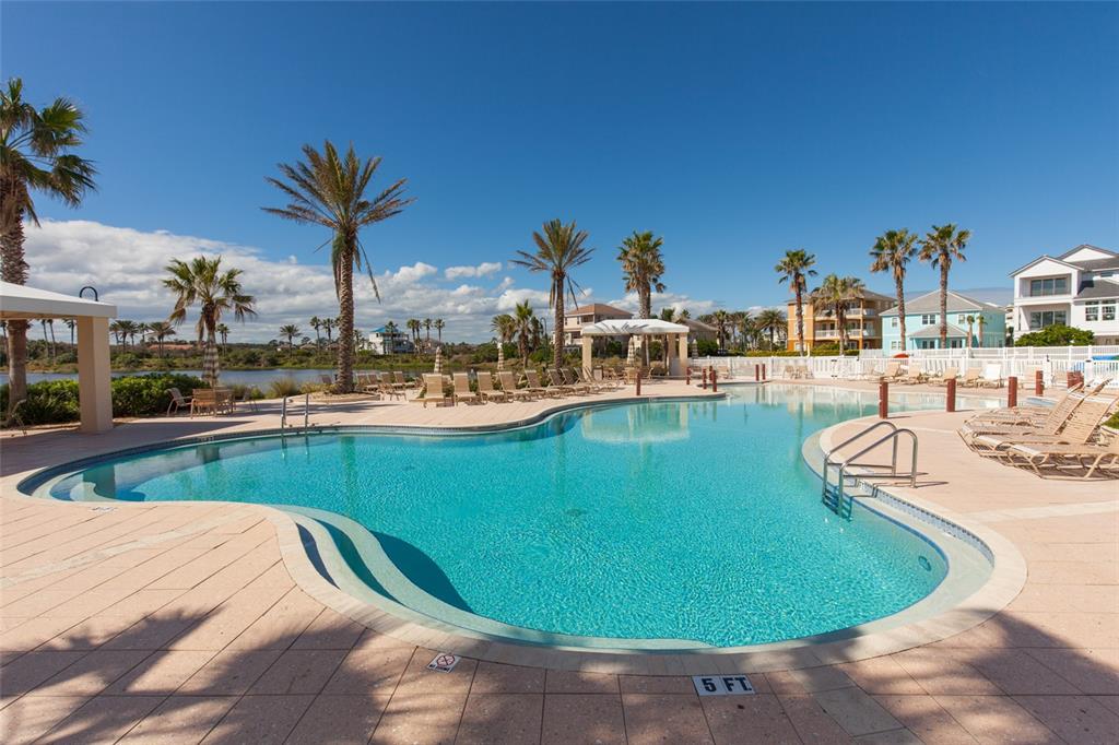6 Cinnamon Beach Way Palm Coast, FL 32137 - Photo 40 of 58 a view of a swimming pool with outdoor seating